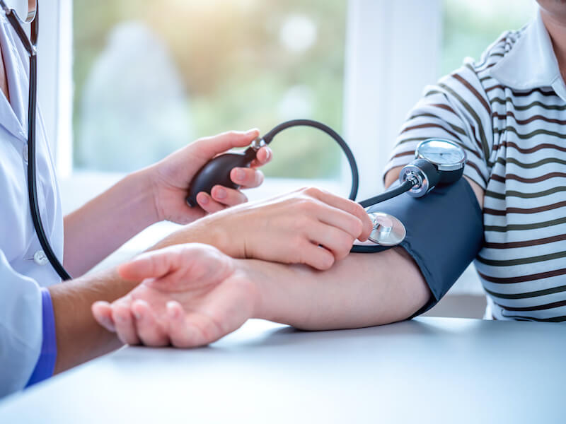 Doctor measures the pressure of the patient during a medical examination and consultation in the hospital