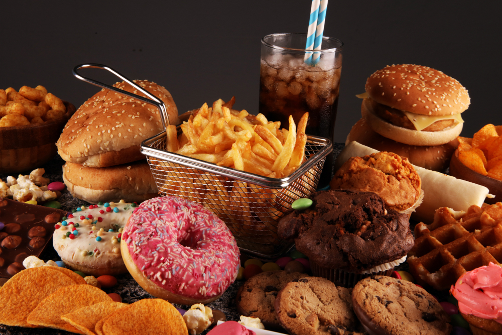 Variety of junk food on table.