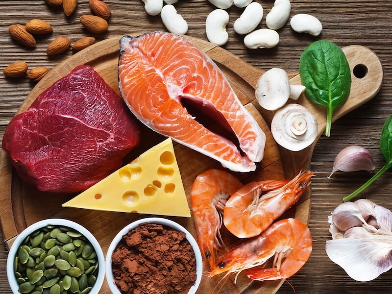 Foods High in Zinc as salmon, seafood-shrimps, beef, yellow cheese, spinach, mushrooms, cocoa, pumpkin seeds, garlic, bean and almonds.